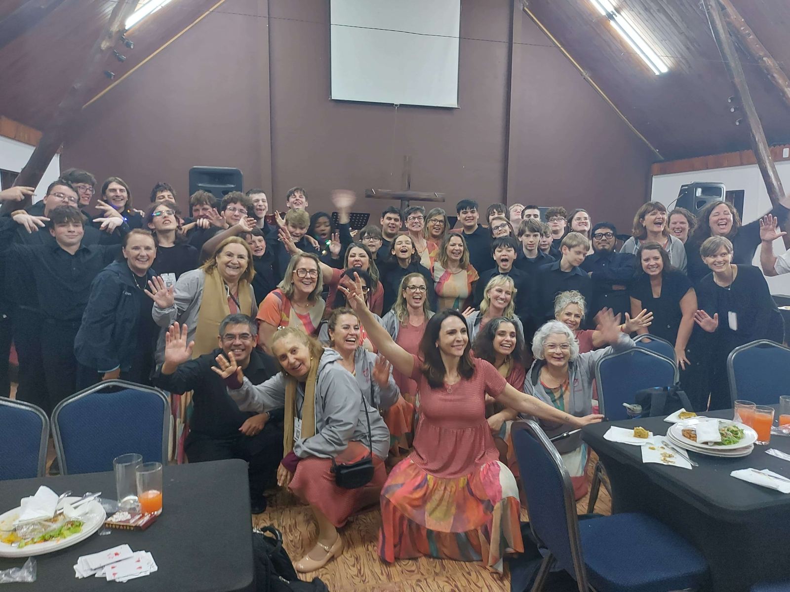 Choir delegations celebrating during a Choral Fest Costa Rica fellowship dinner.