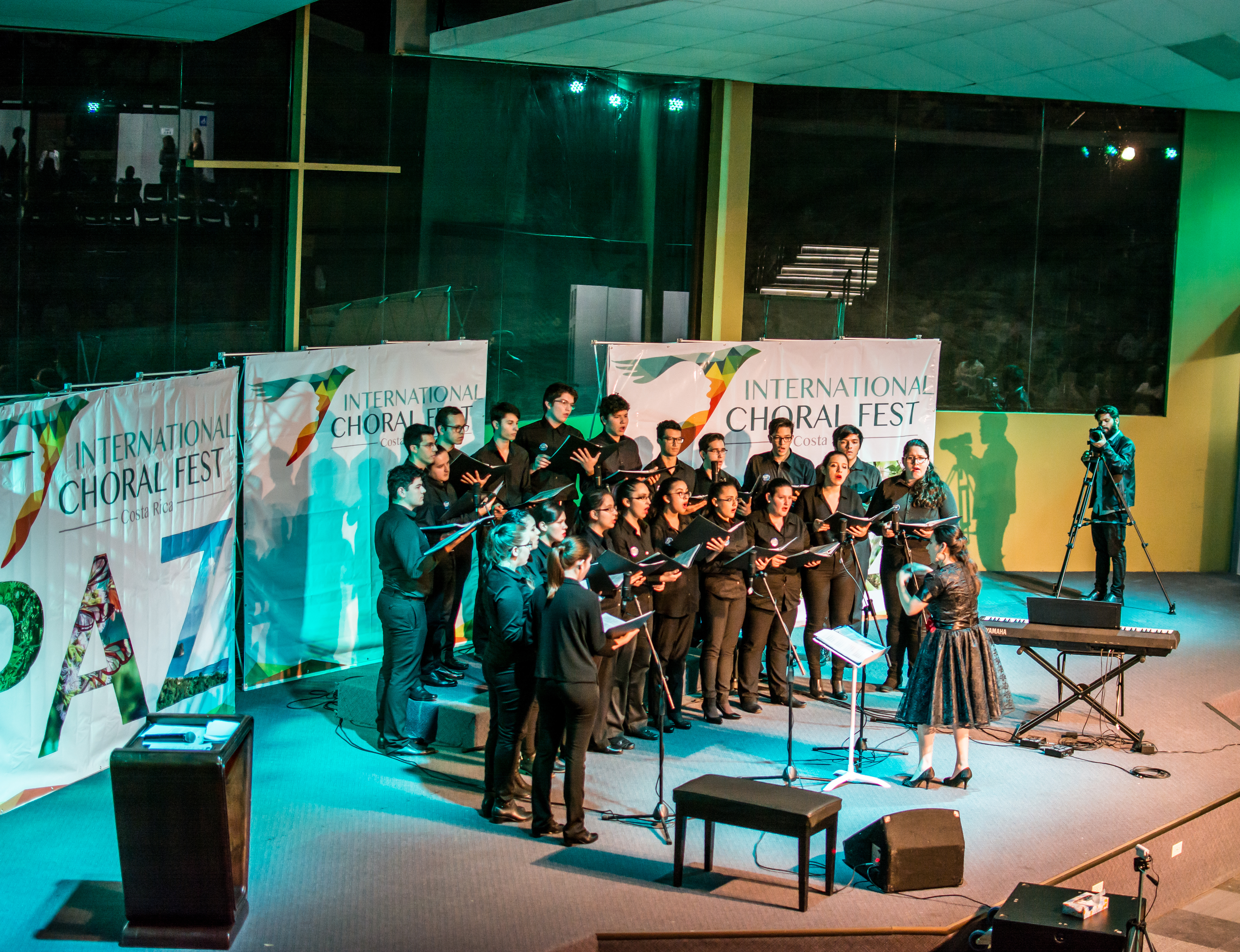 Choir performing with a conductor at Choral Fest Costa Rica during an international choral performance