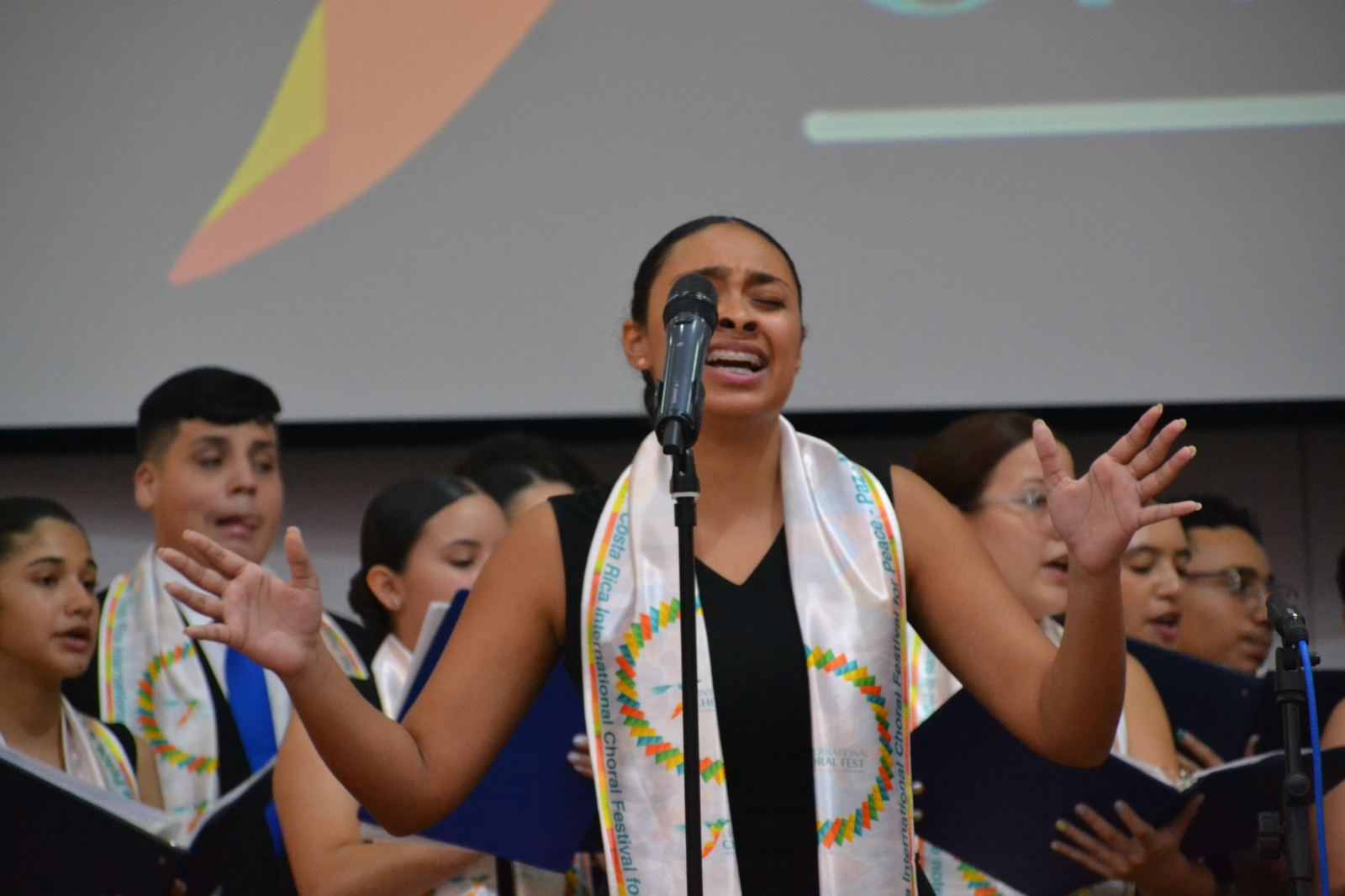 Choir singer performing during Choral Fest Costa Rica for Peace, representing international connection through music and cultural exchange.
