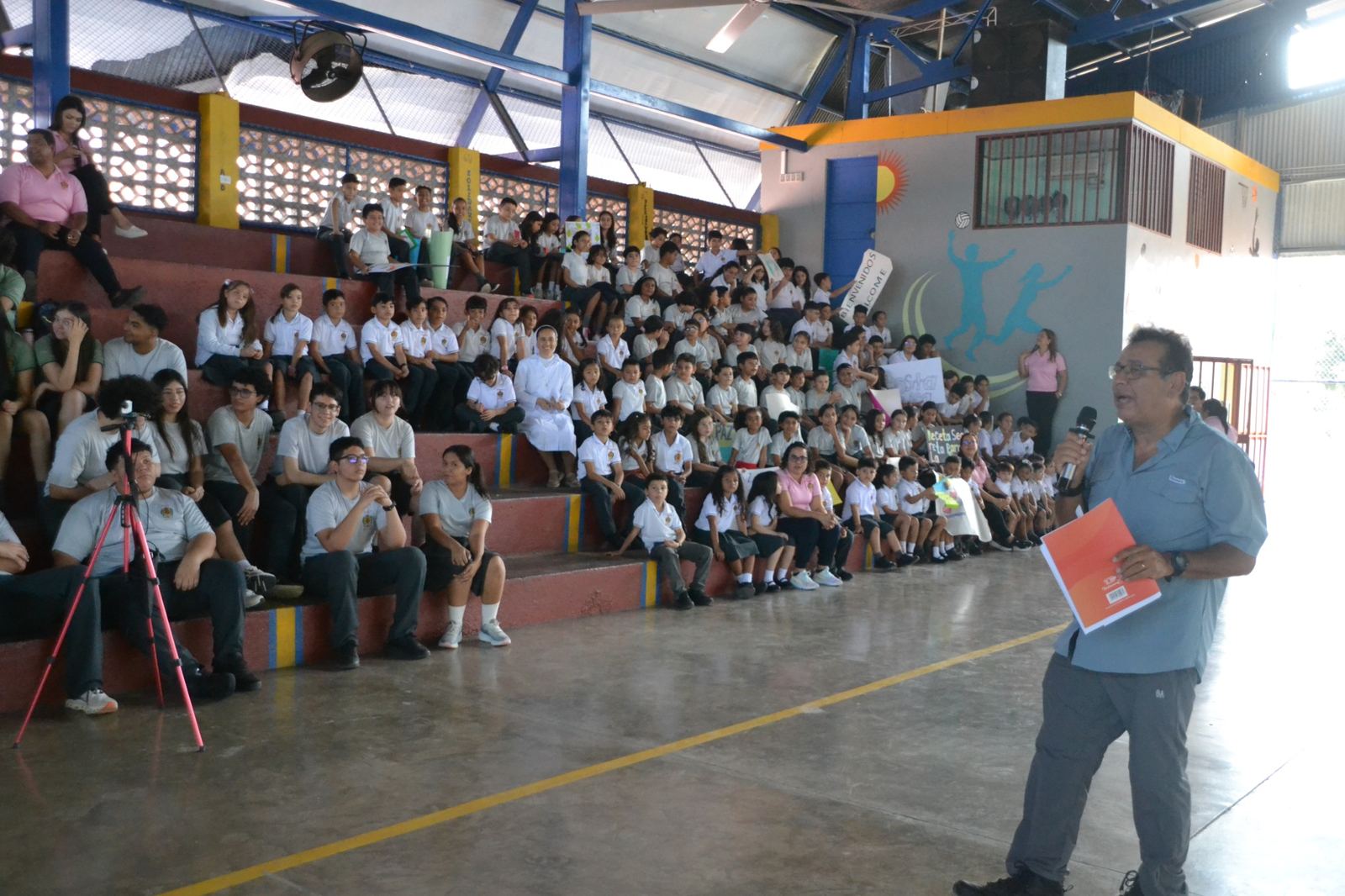 Choral Fest Costa Rica for Peace speaker sharing a message about music and peace with students during a school community activity.